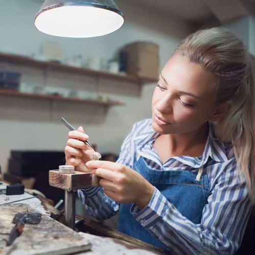 Exclusive Jewellery Making Workshops - Woman at Jewellery Bench Exclusive Jewellery Making Workshops - Woman at Jewellery Bench